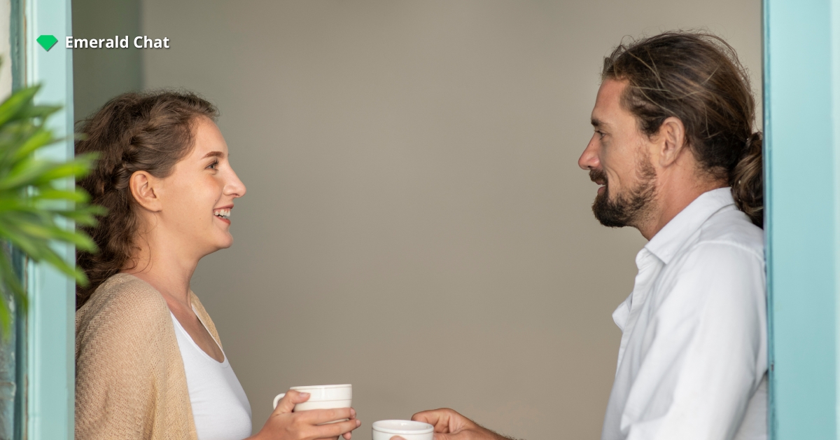 A man and woman holding a cup