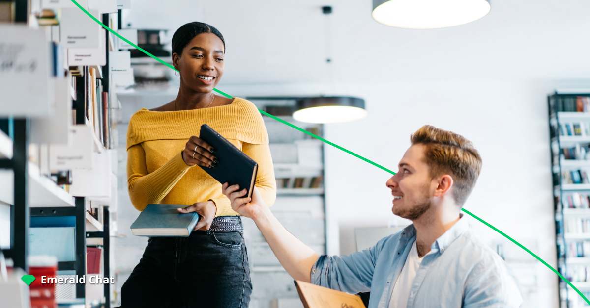 a man handling a book to a woman